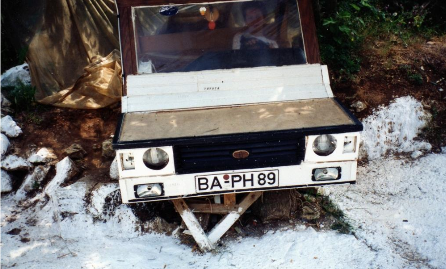 First car - rear view with hand-painted license plates
